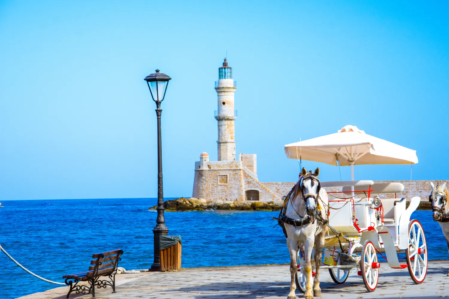 Chania The Old Harbor Of Chania With Horse Carriages And Lighthouse, Crete, Greece 1 image